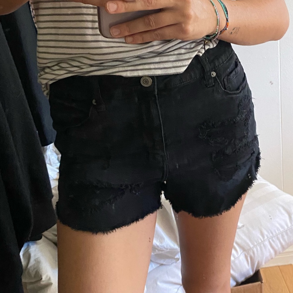 black ripped shorts